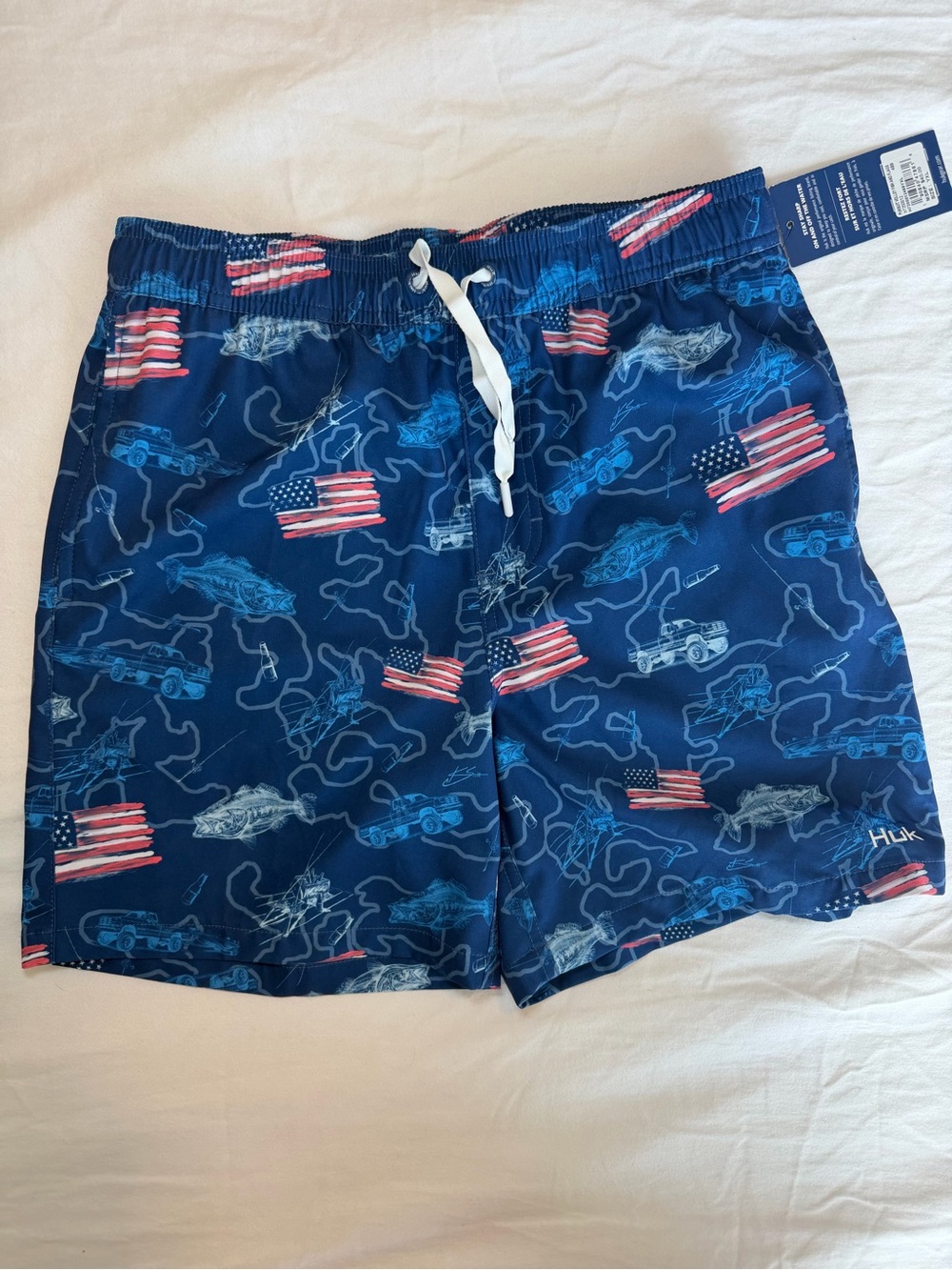 Huk Blue Swim Trunks with American Flag Accent